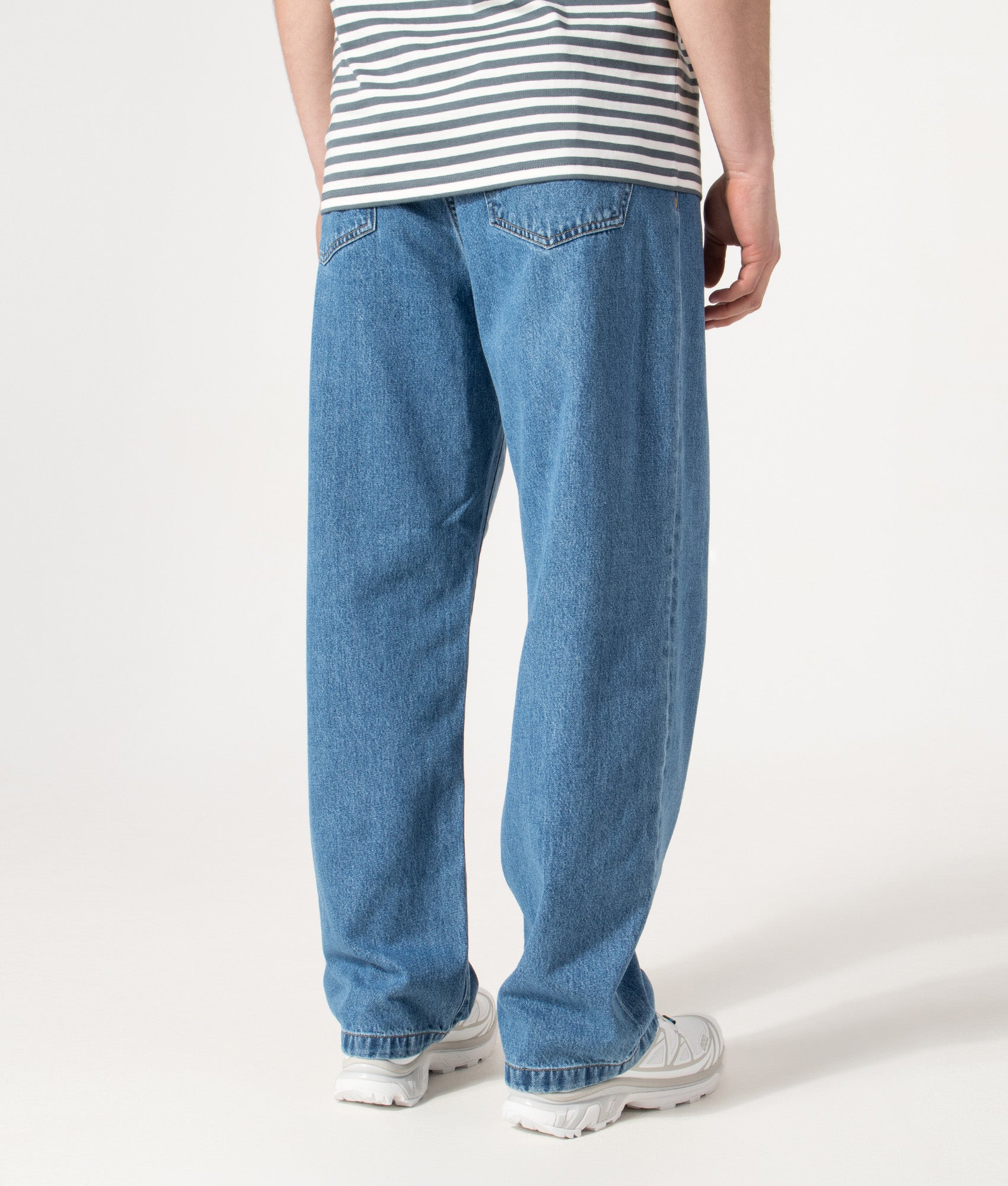 Carhartt WIP Relaxed Fit Landon Jeans in Blue at EQVVS Menswear. Model back shot.