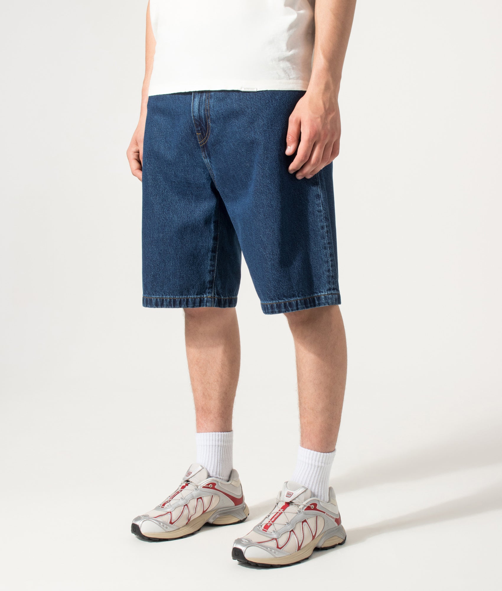 Carhartt WIP Loose Fit Landon Denim Shorts in Blue at EQVVS Menswear. Angled model front shot.