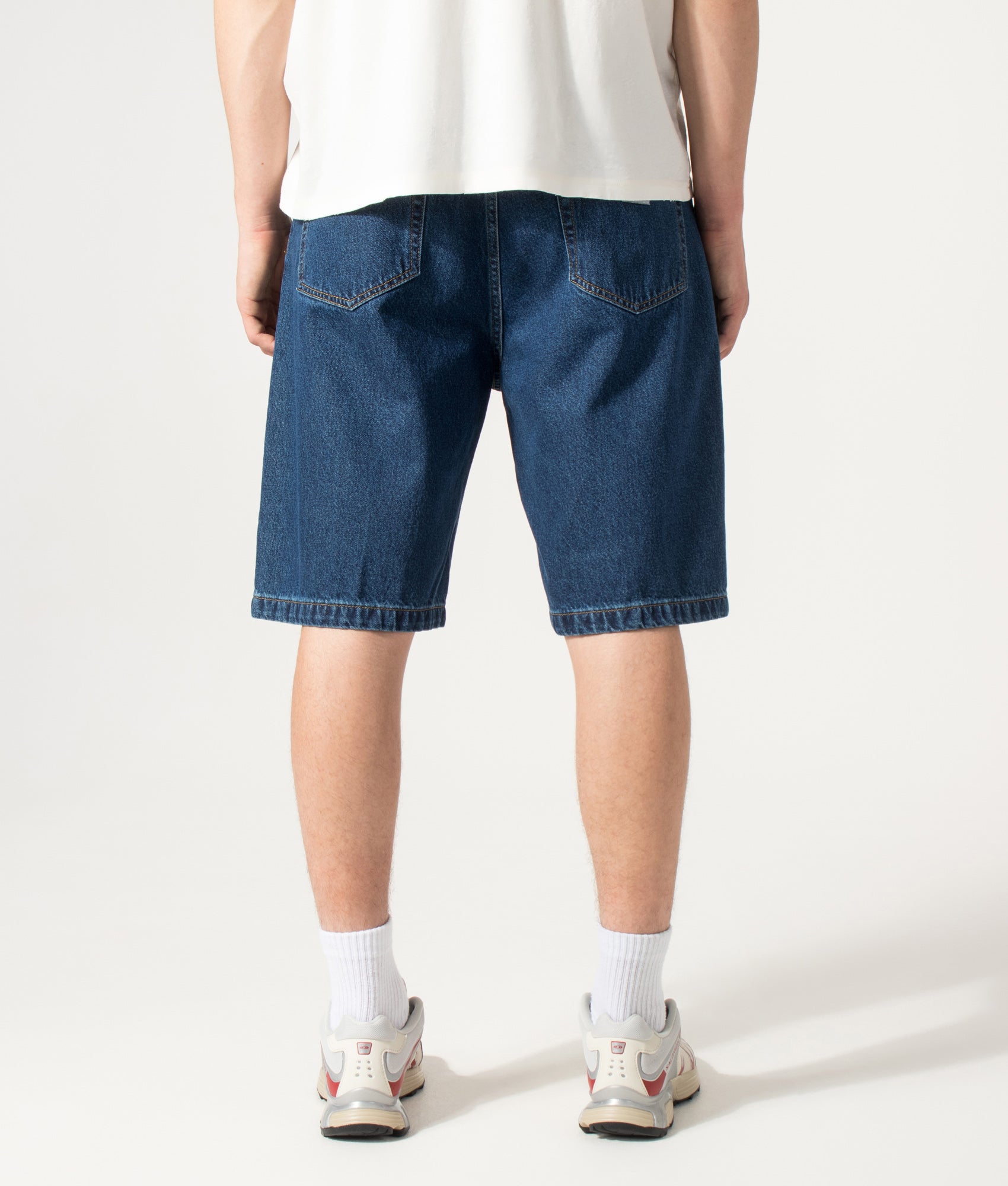 Carhartt WIP Loose Fit Landon Denim Shorts in Blue at EQVVS Menswear. Model back shot.