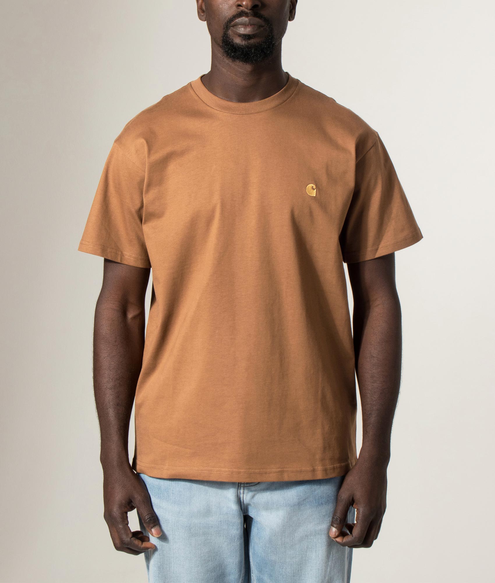 Carhartt WIP Loose Fit Chase T-Shirt in Hamilton brown and Gold at EQVVS Menswear. Model front shot.