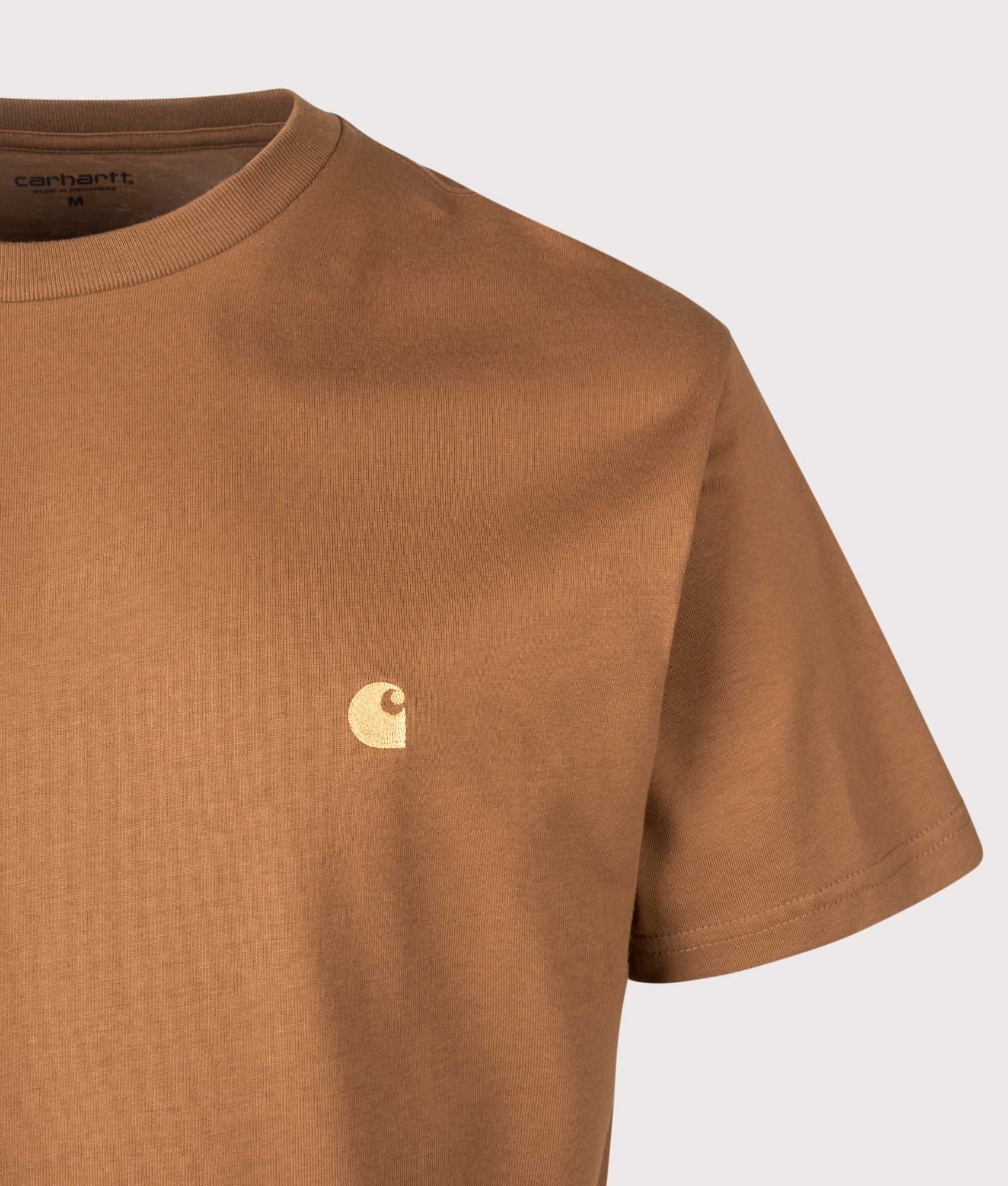 Carhartt WIP Relaxed Fit Chase T-Shirt in Hamilton brown and Gold at EQVVS Menswear. Detail shot.