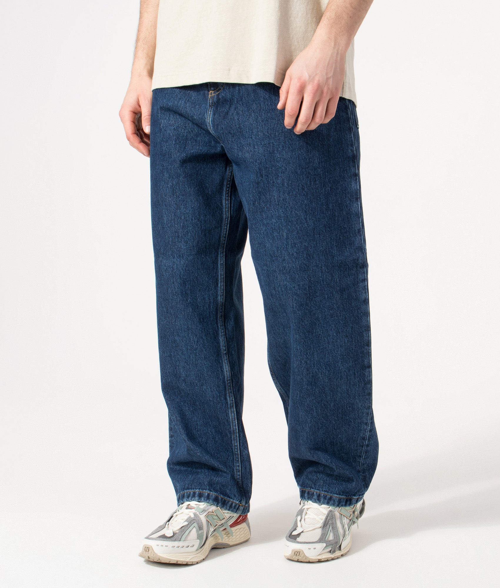 Carhartt WIP Brandon Jeans in Blue Stone Washed at EQVVS Menswear. Angled model front shot.