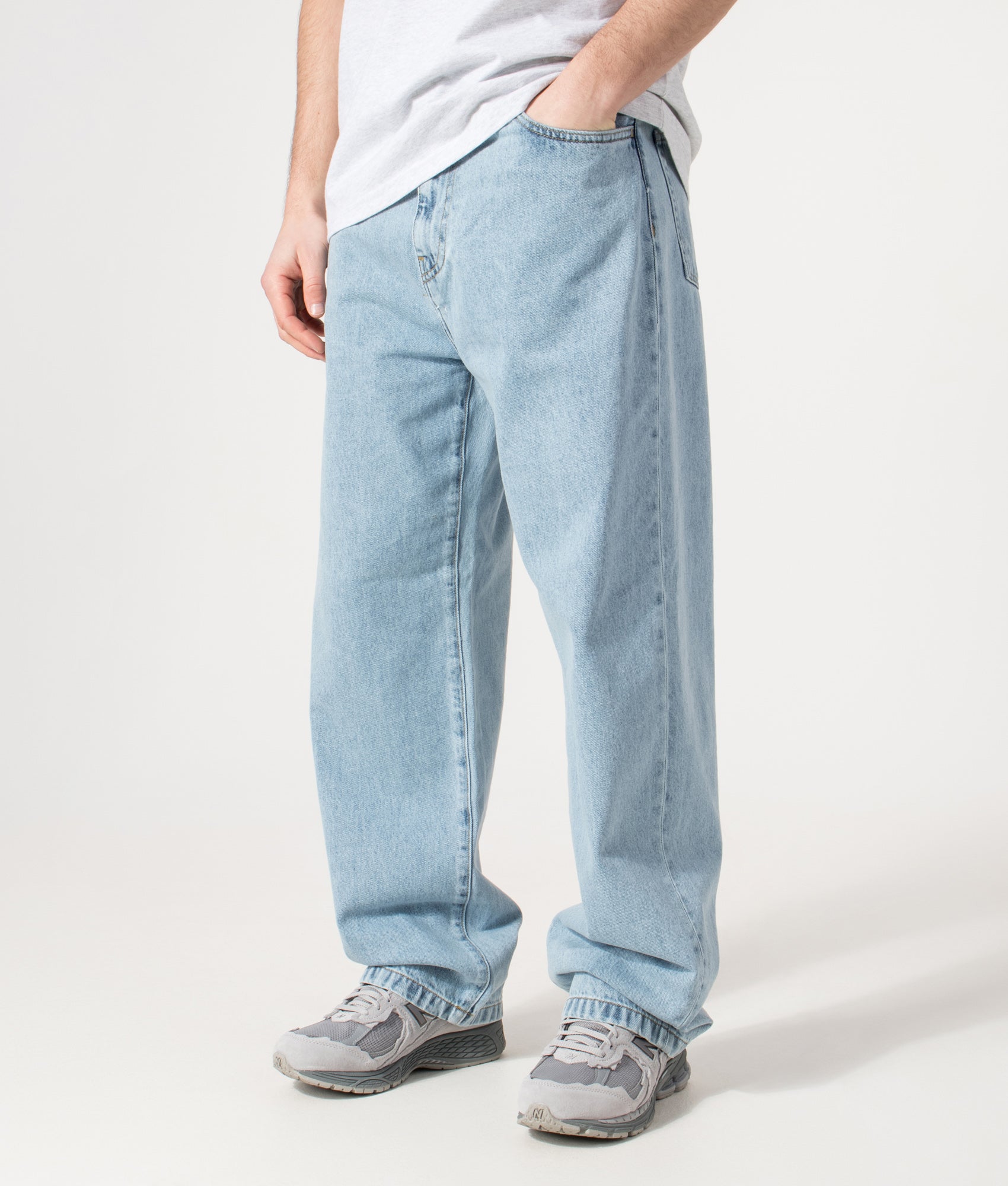 Carhartt WIP Landon Jeans in blue at EQVVS Menswear. Angled model front shot.