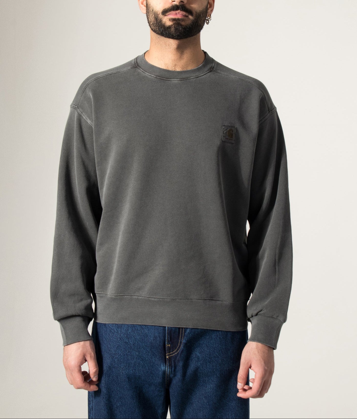 Carhartt WIP Oversized Nelson Sweatshirt in Black at EQVVS Menswear. Model front shot.