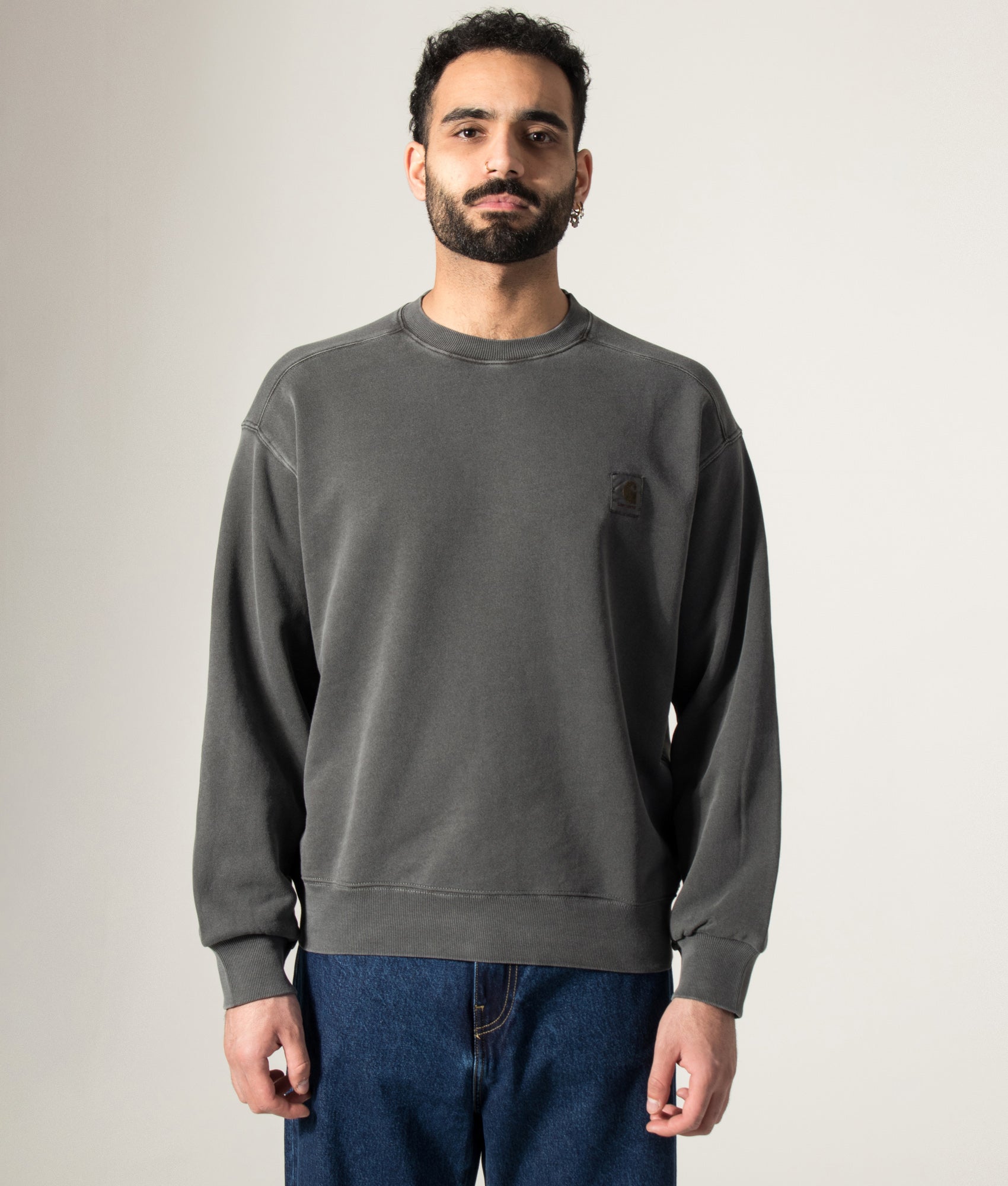 Carhartt WIP Oversized Nelson Sweatshirt in Black at EQVVS Menswear. Model front shot.