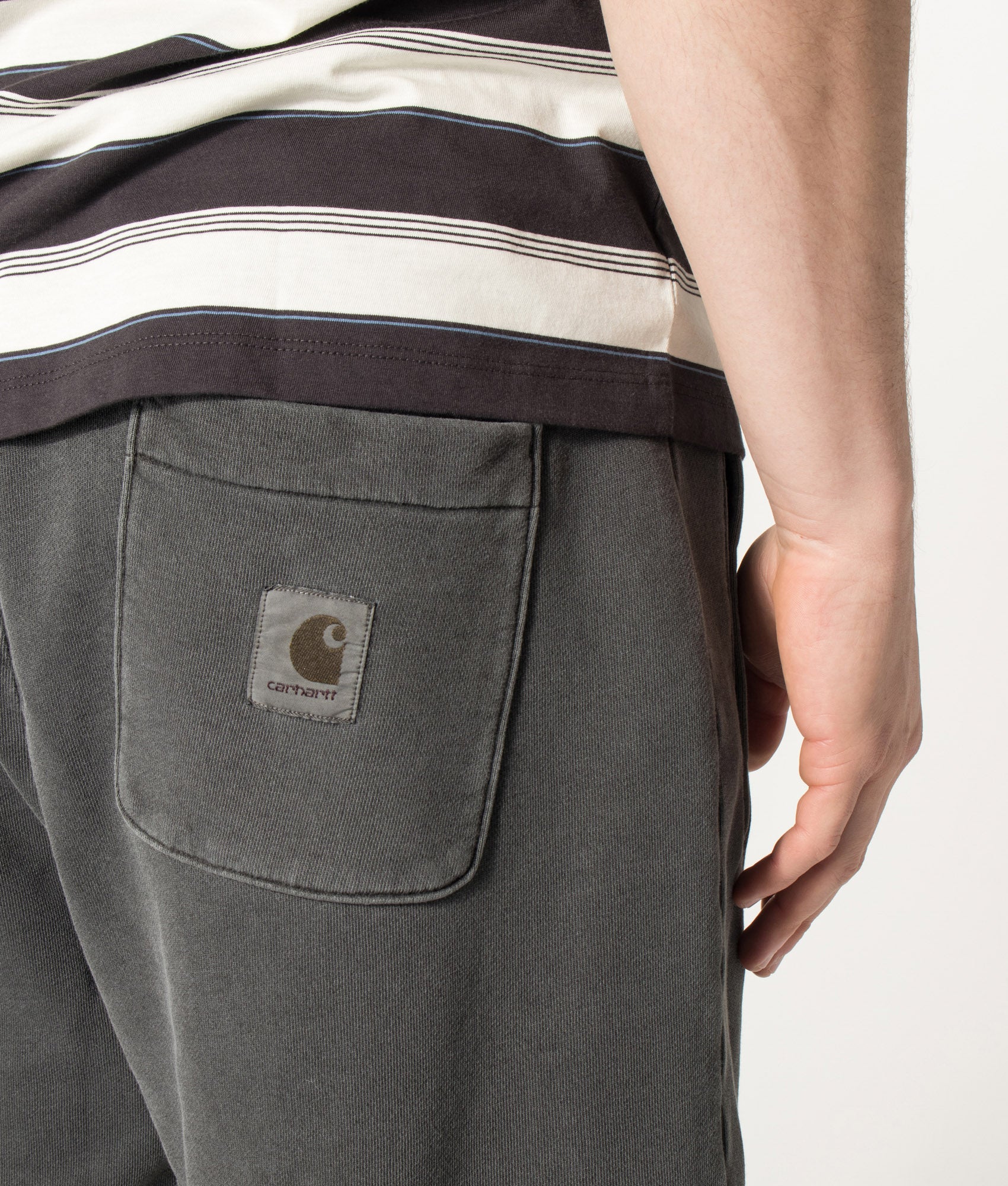 Carhartt WIP Balloon Fit Nelson Sweat Shorts in Black at EQVVS Menswear. Detail shot.