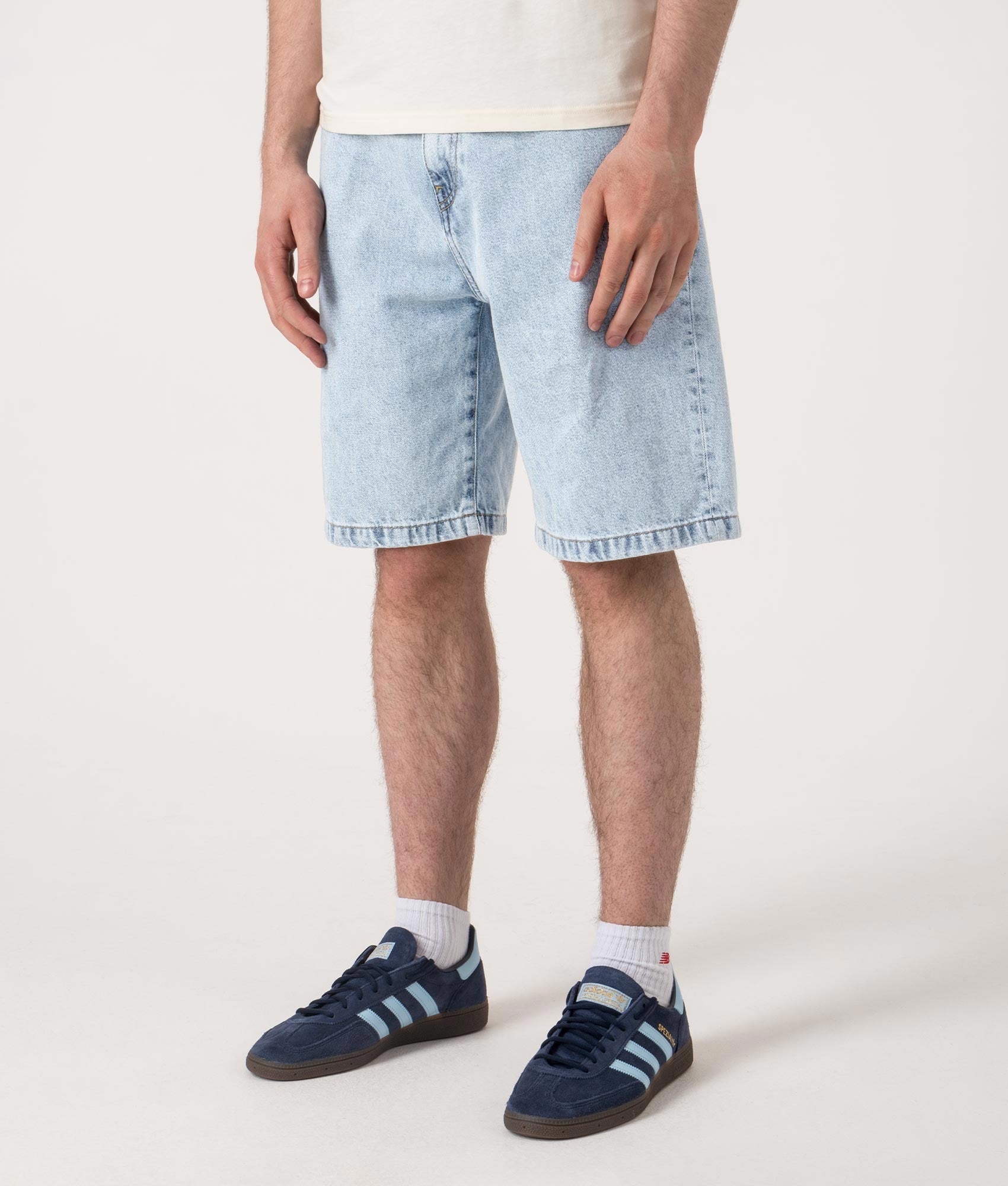 Relaxed Fit Landon Denim Shorts in Blue by Carhartt WIP. Shot by EQVVS. Front angled shot.