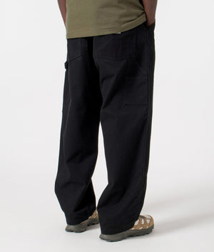 Carhartt WIP Relaxed Fit Wide Panel Pants in Black Rinsed, 100% Cotton Model Back Shot at EQVVS