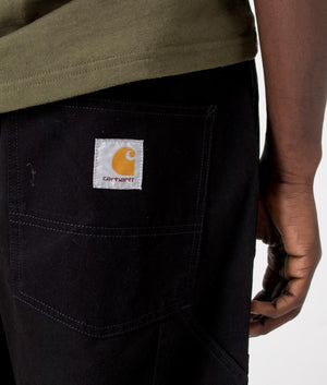 Carhartt WIP Relaxed Fit Wide Panel Pants in Black Rinsed, 100% Cotton Model Detail Shot at EQVVS