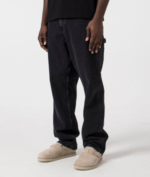 Relaxed Fit Single Knee Pants in Black Stonewashed by Carhartt Wip. EQVVS Side Angle Shot.