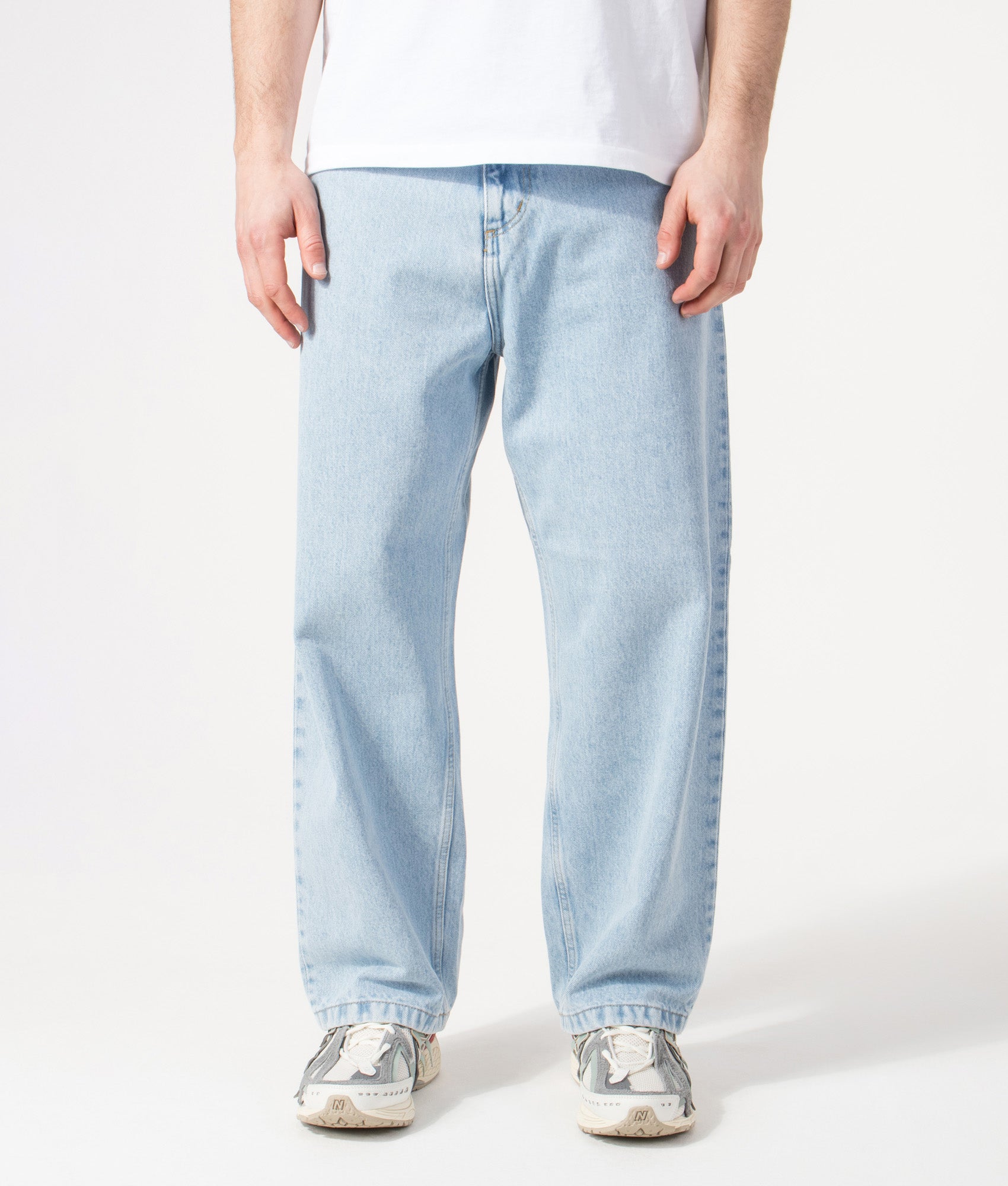 Carhartt WIP Relaxed Fit Brandon Jeans in  Blue Heavy Stone Bleached at EQVVS Menswear. Model front shot.