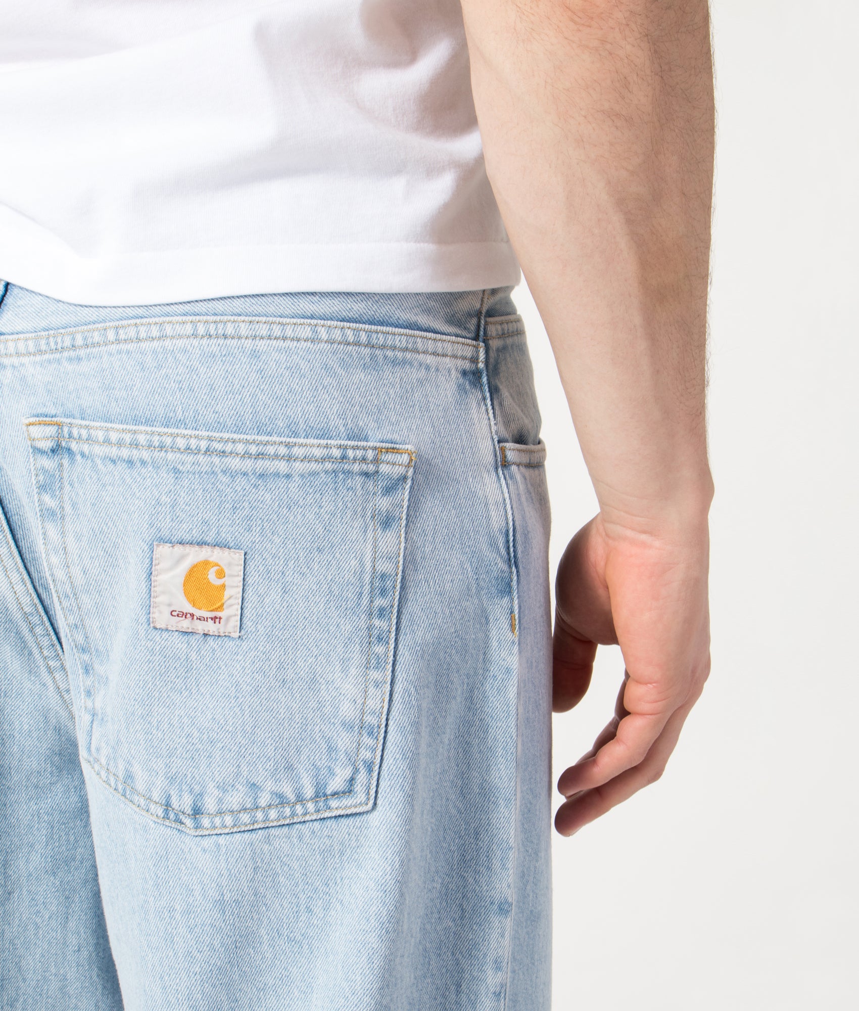 Carhartt WIP Relaxed Fit Brandon Jeans in  Blue Heavy Stone Bleached at EQVVS Menswear. Back detail shot.