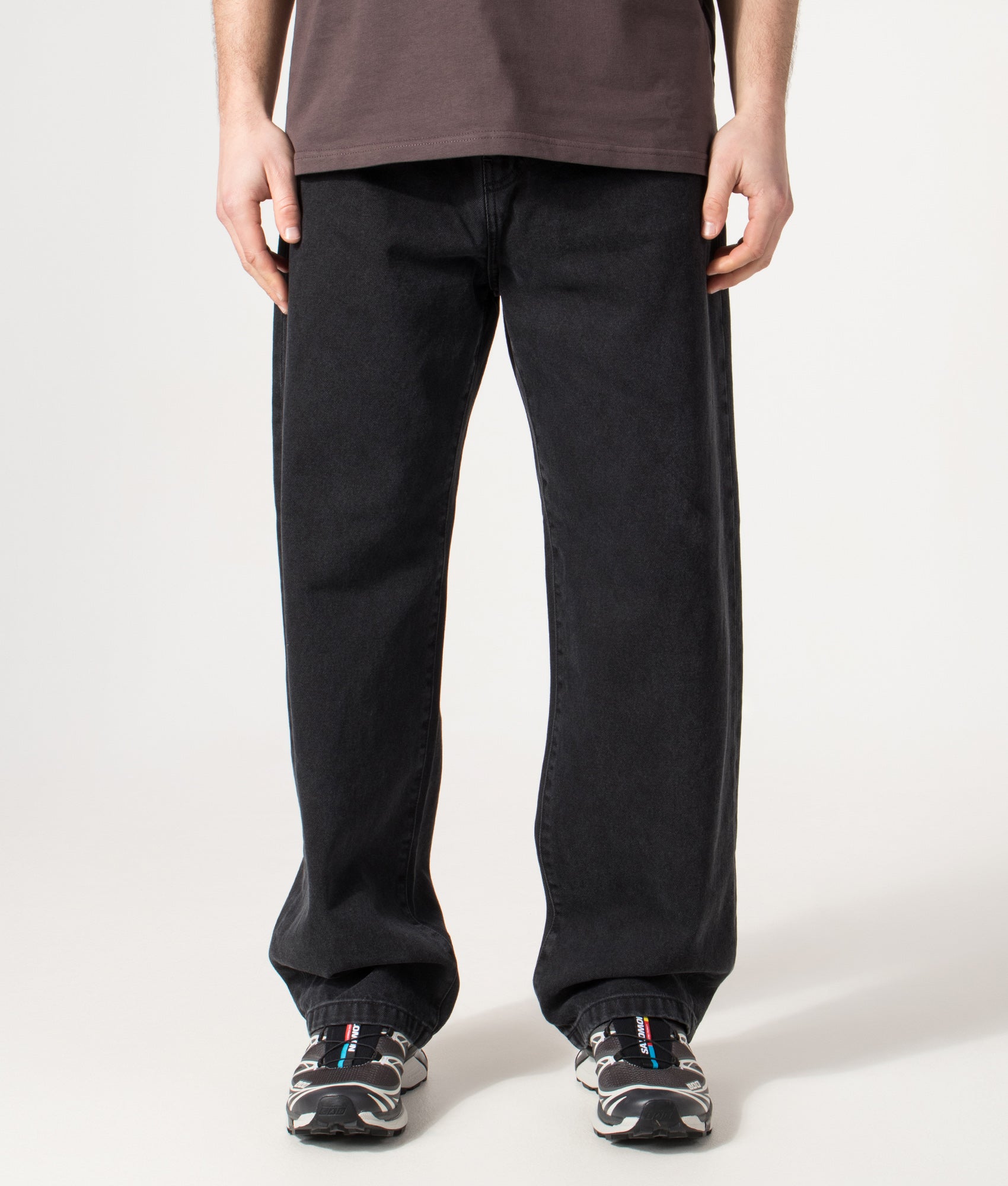 Carhartt WIP Landon Jeans in Black Stone Washed at EQVVS Menswear. Model front shot.