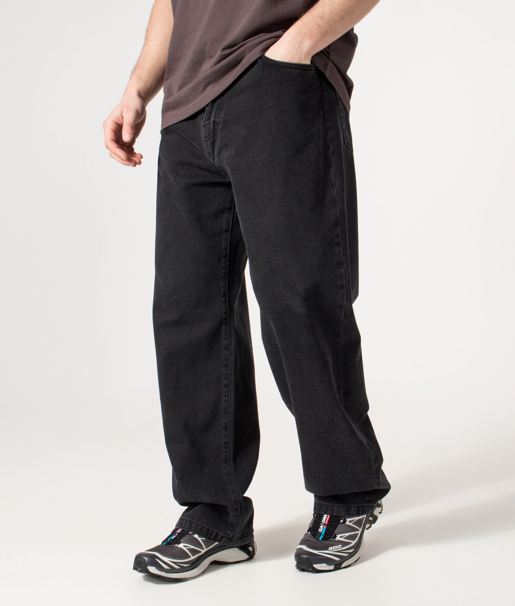 Carhartt WIP Landon Jeans in Black Stone Washed at EQVVS Menswear. Model angled front shot.