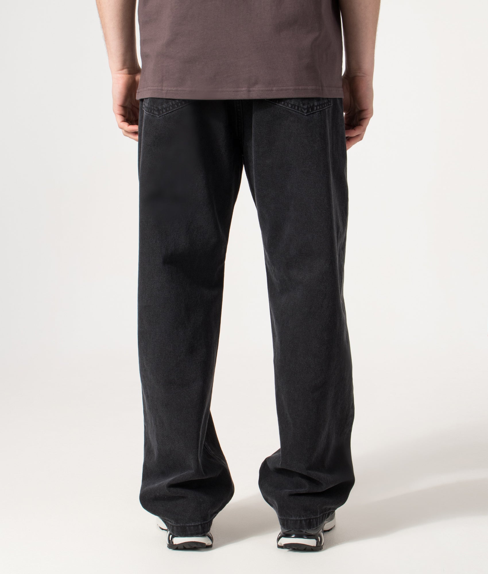Carhartt WIP Landon Jeans in Black Stone Washed at EQVVS Menswear. Model back shot.