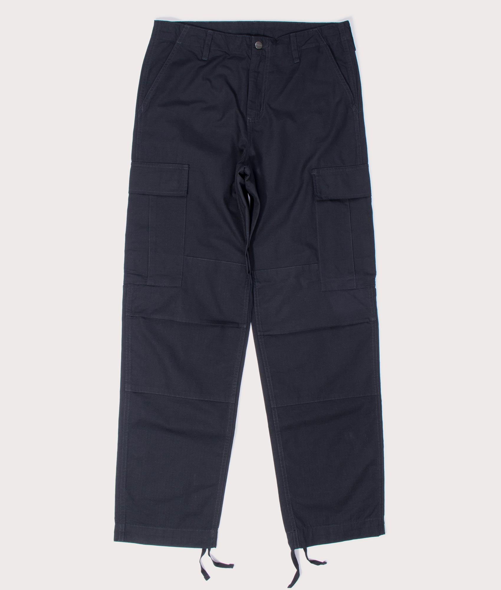 Carhartt Regular Fit Cargo Pants in Black at EQVVS Menswear. Flat front shot.