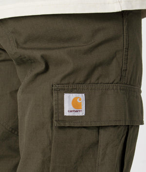 Regular Fit Cargo Pants in Cyprus Rinsed by Carhartt. EQVVS Detail Shot.