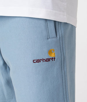 Carhartt WIP Relaxed Fit American Script Sweat Shorts in Frosted Blue Detail Shot at EQVVS