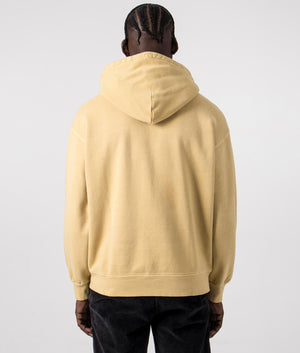 Carhartt WIP Oversized Nelson Hoodie in Bourbon Yellow, 100% Cotton. Back Model Shot at EQVVS