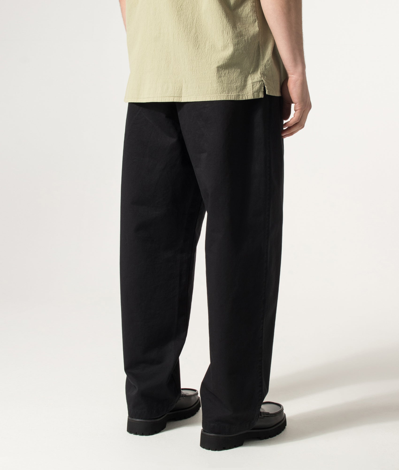 Carhartt WIP Marv Pants in Black Stone Washed at EQVVS Menswear. Model back shot.