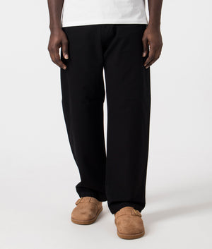 Relaxed Fit Landon Pants in Black by Carhartt WIP. EQVVS Front Angle Shot.