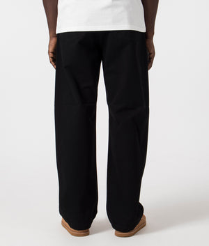 Relaxed Fit Landon Pants in Black by Carhartt WIP. EQVVS Back Angle Shot.