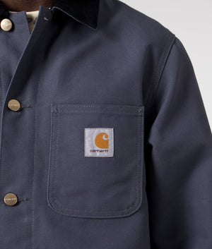 Carhartt WIP Michigan Coat in Zeus Blue and Black Rigid, 100% Organic Cotton Model Detail Shot at EQVVS