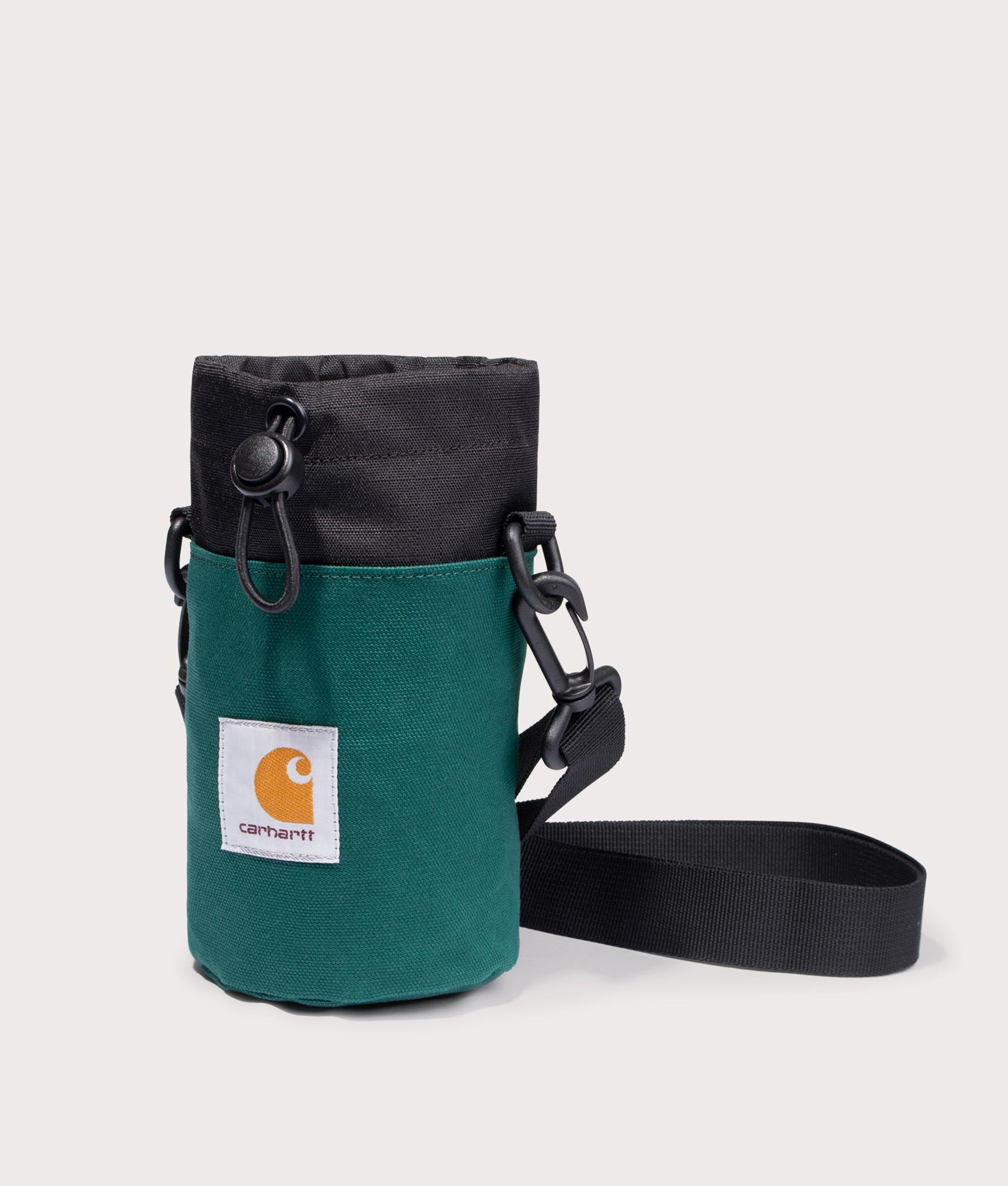 Carhartt WIP Groundworks Bottle-Carrier in 1ZUXX Chervil/Black front with strap shot at EQVVS