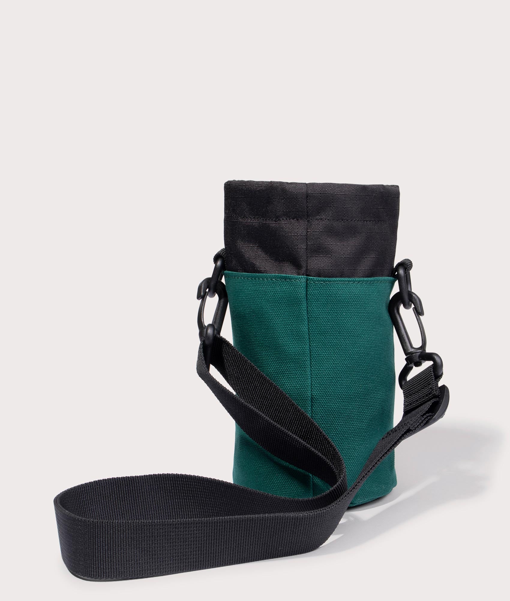 Carhartt WIP Groundworks Bottle-Carrier in 1ZUXX Chervil/Black back with strap shot at EQVVS