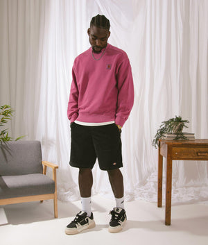 Oversized Nelson Sweatshirt in Magenta by Carhartt WIP. EQVVS Campaign Shot.