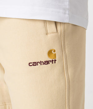 Carhartt WIP Relaxed Fit American Script Sweat Shorts in Rattan Yellow Detail Shot at EQVVS