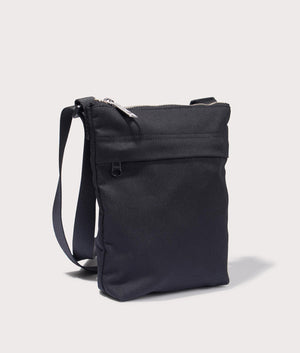 Carhartt Newhaven Shoulder Bag in Black. Side angle shot at EQVVS.