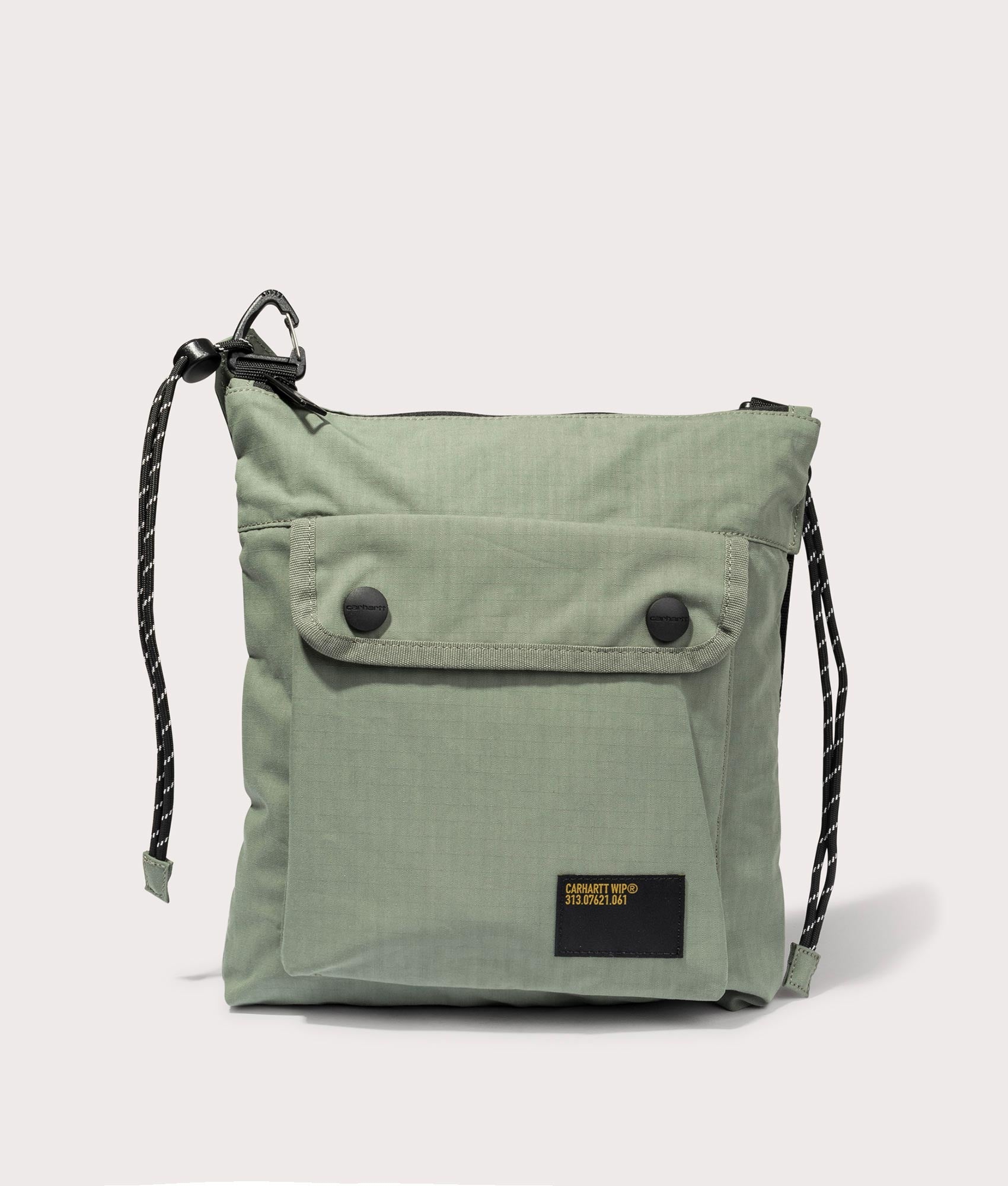 Carhartt WIP Haste Strap Bag in Park. Front angle shot at EQVVS.