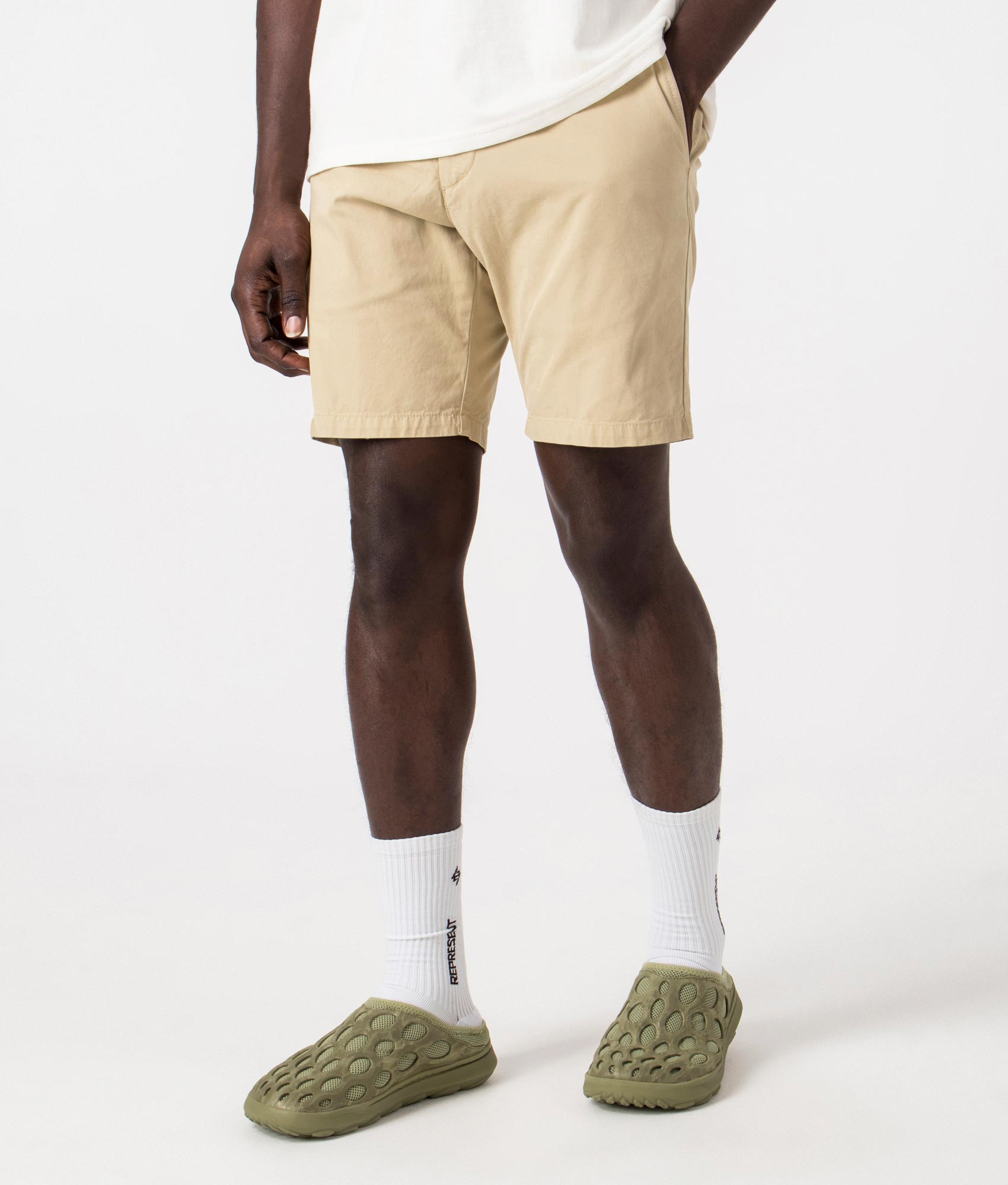 Carhartt WIP John Shorts in Sable Beige, 100% Cotton. Angle Shot at EQVVS.