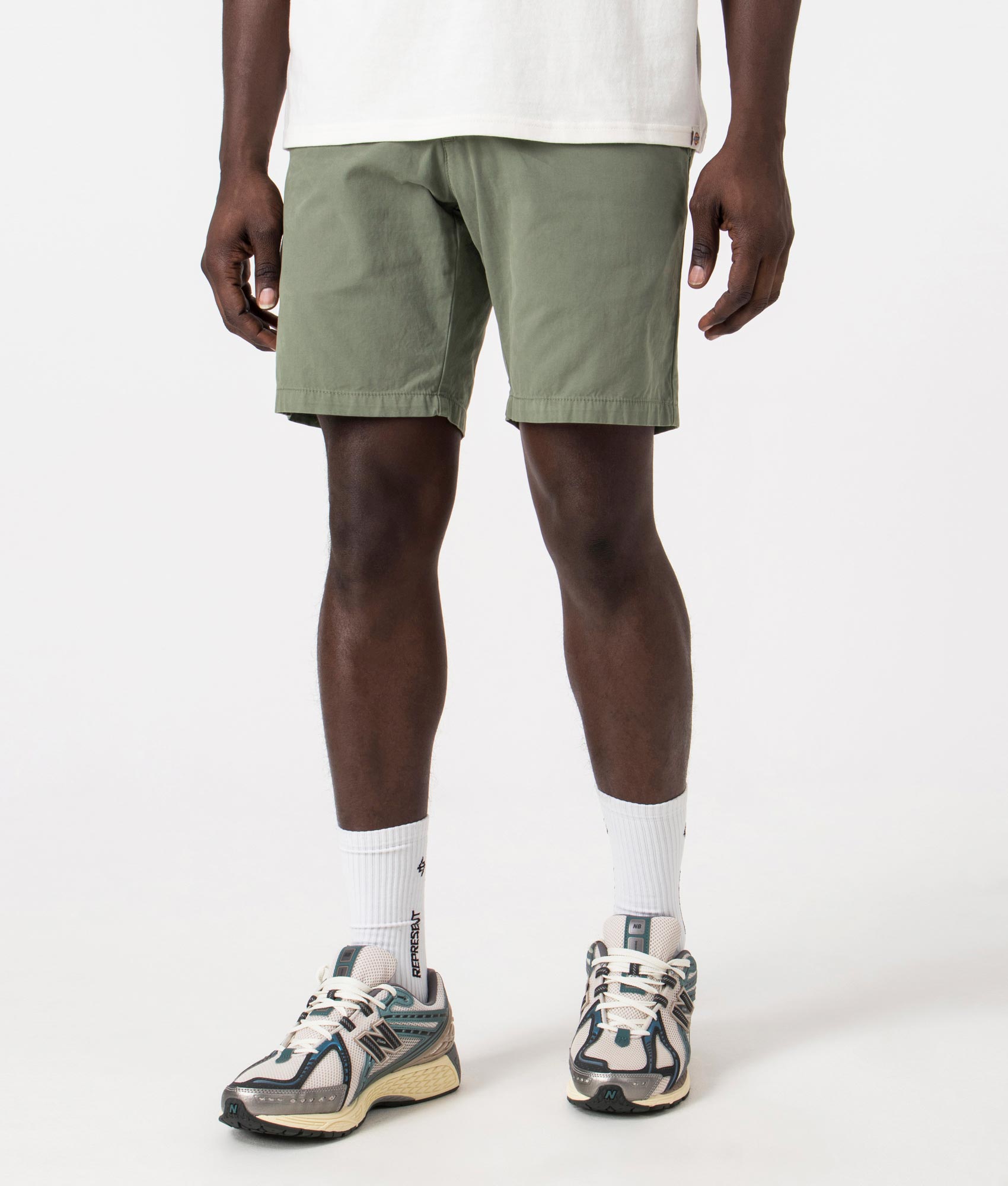Carhartt WIP John Shorts in Park Green, 100% Cotton. Angle Shot at EQVVS
