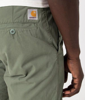 Carhartt WIP John Shorts in Park Green, 100% Cotton. Detail Shot at EQVVS