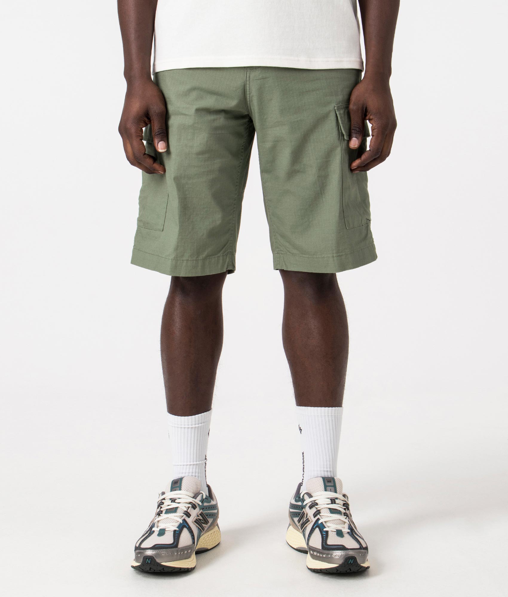 Carhartt WIP Regular Cargo Shorts in Park Green, 100% Cotton. Front Model Shot at EQVVS
