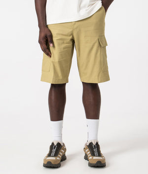 Carhartt WIP Regular Cargo Shorts in Agate Beige, 100% Cotton. Front Model Shot at EQVVS