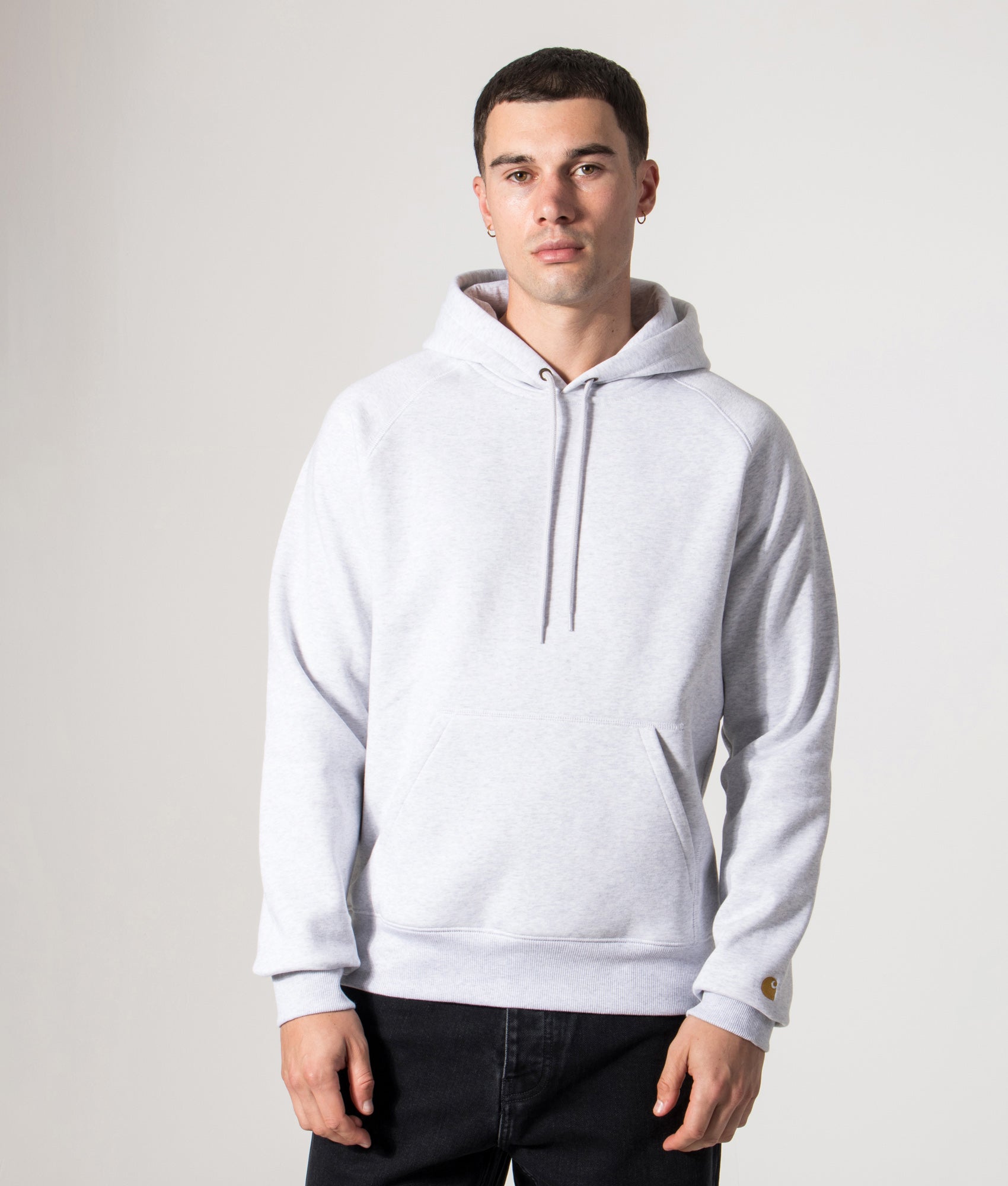 Carhartt WIP Chase Hoodie in Ash Heather/Gold at EQVVS Menswear. Model front shot.