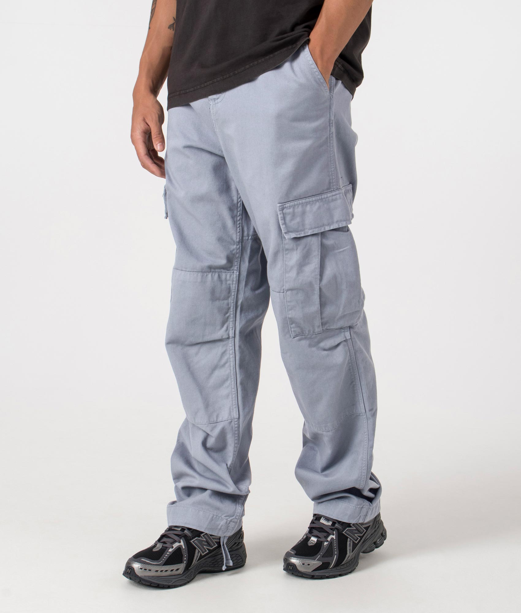 Dove Grey Carhartt WIP Cargo Pants, shot at EQVVS. Side shot. 