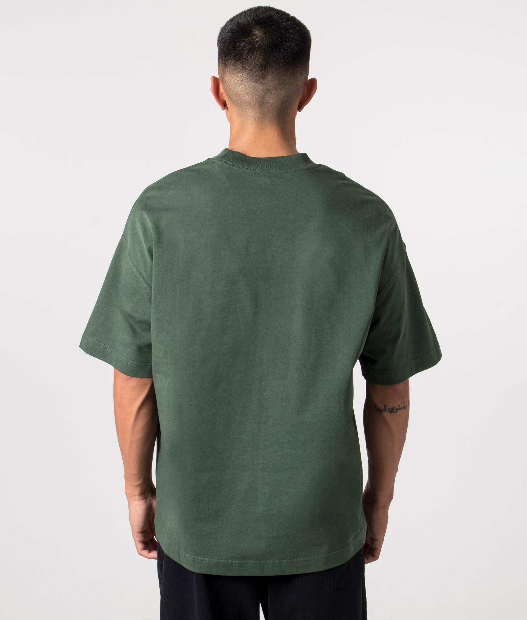 Signature Script T-Shirt in Sycamore Green by Carhartt WIP. Shot at EQVVS. Reverse shot. 