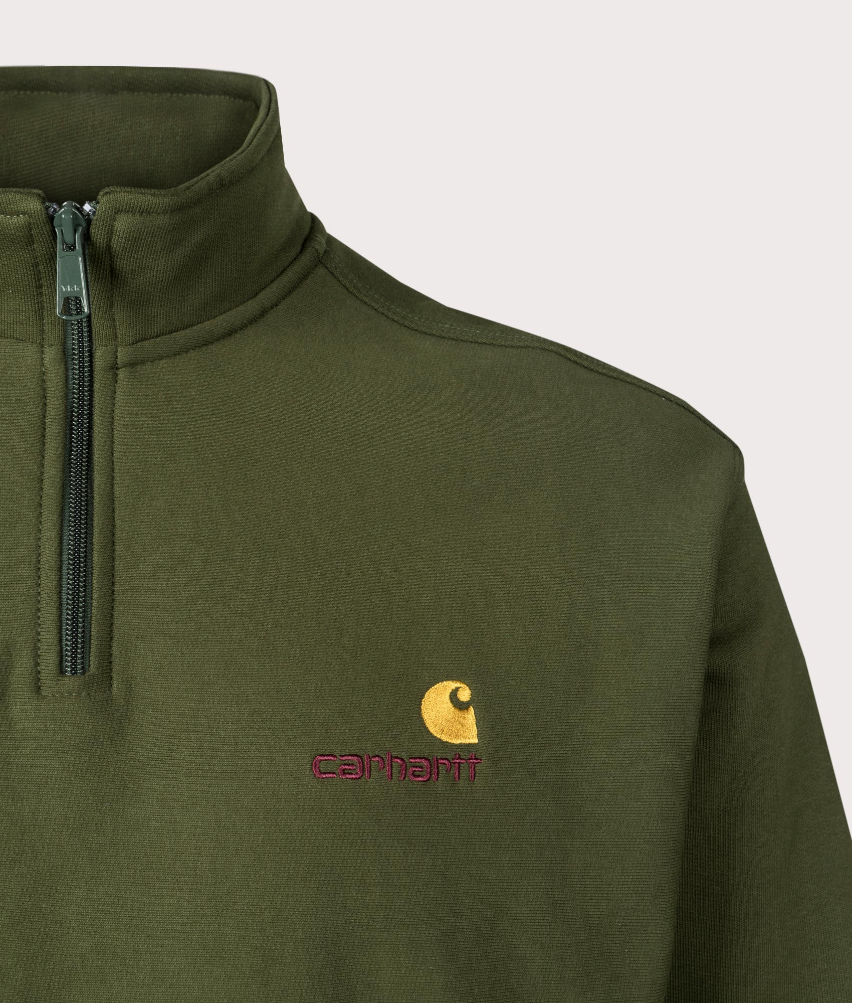 Carharrt WIP Relaxed Fit Half Zip American Script Sweatshirt in tarragon. At EQVVS Menswear. Front logo shot