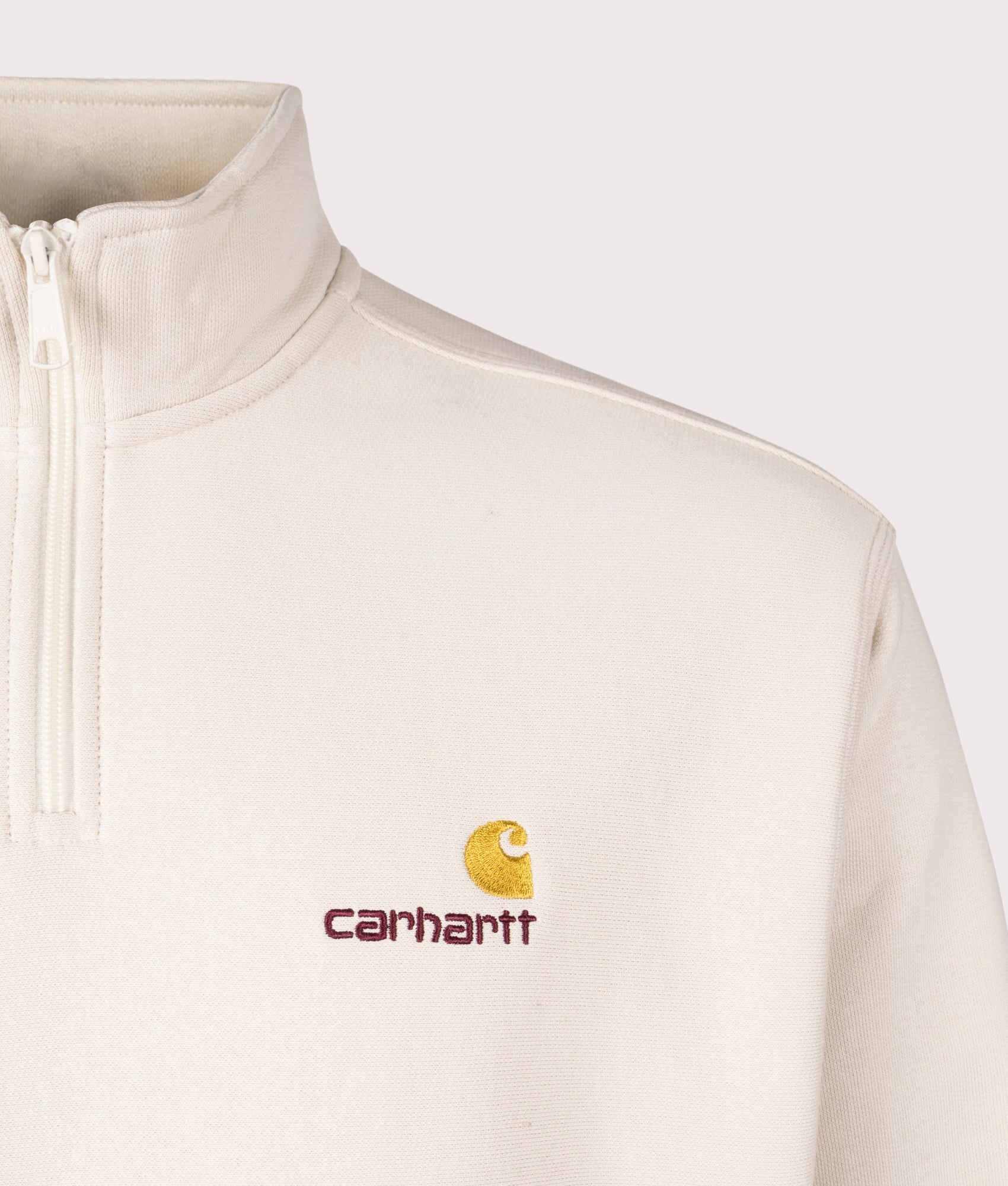 Carhartt WIP Relaxed Fit Quarter Zip American Script Sweatshirt in Moonbeam White at EQVVS Menswear. Detail shot.