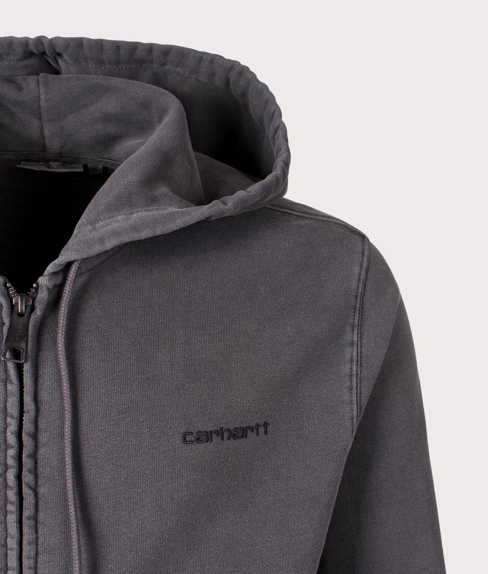 Carhartt WIP Relaxed Fit Duster Script Zip Through Hoodie in Black. Detail angle shot at EQVVS.
