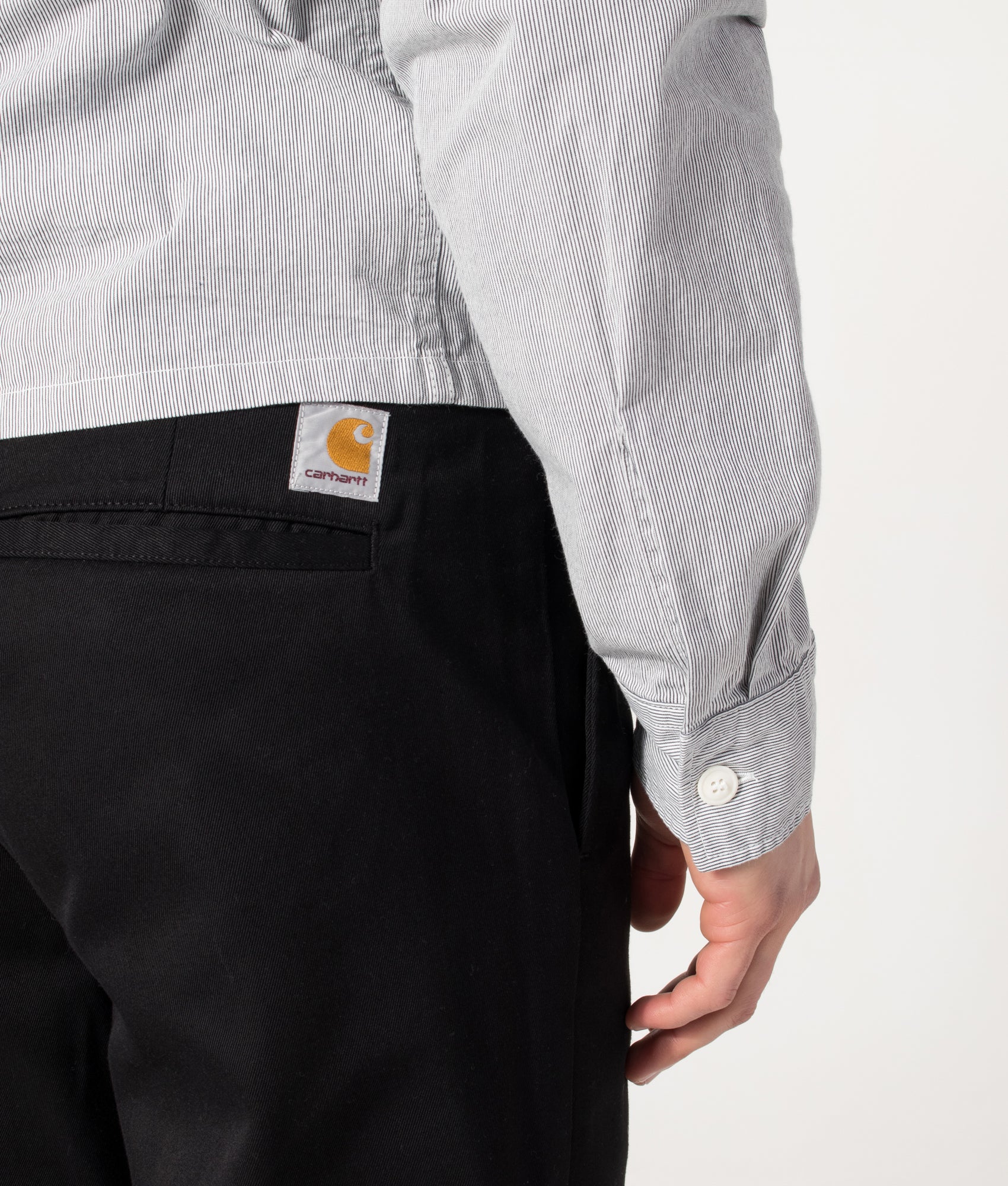 Carhartt WIP Relaxed Fit Tapered Master Pants in Black at EQVVS Menswear. Back detail shot.