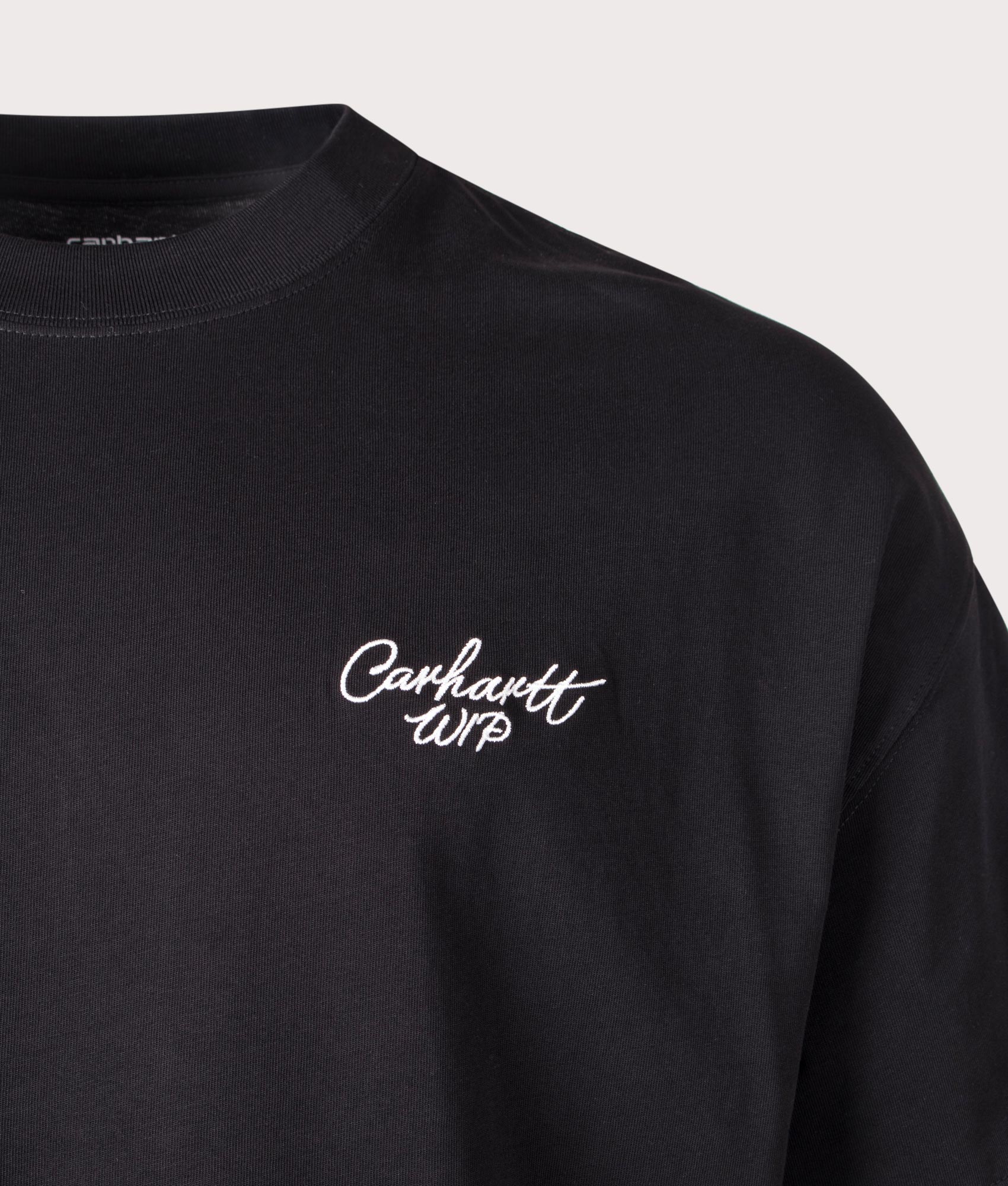 Carhartt WIP Signature Script T-Shirt in Black/Wax at EQVVS Menswear. Detail shot. 