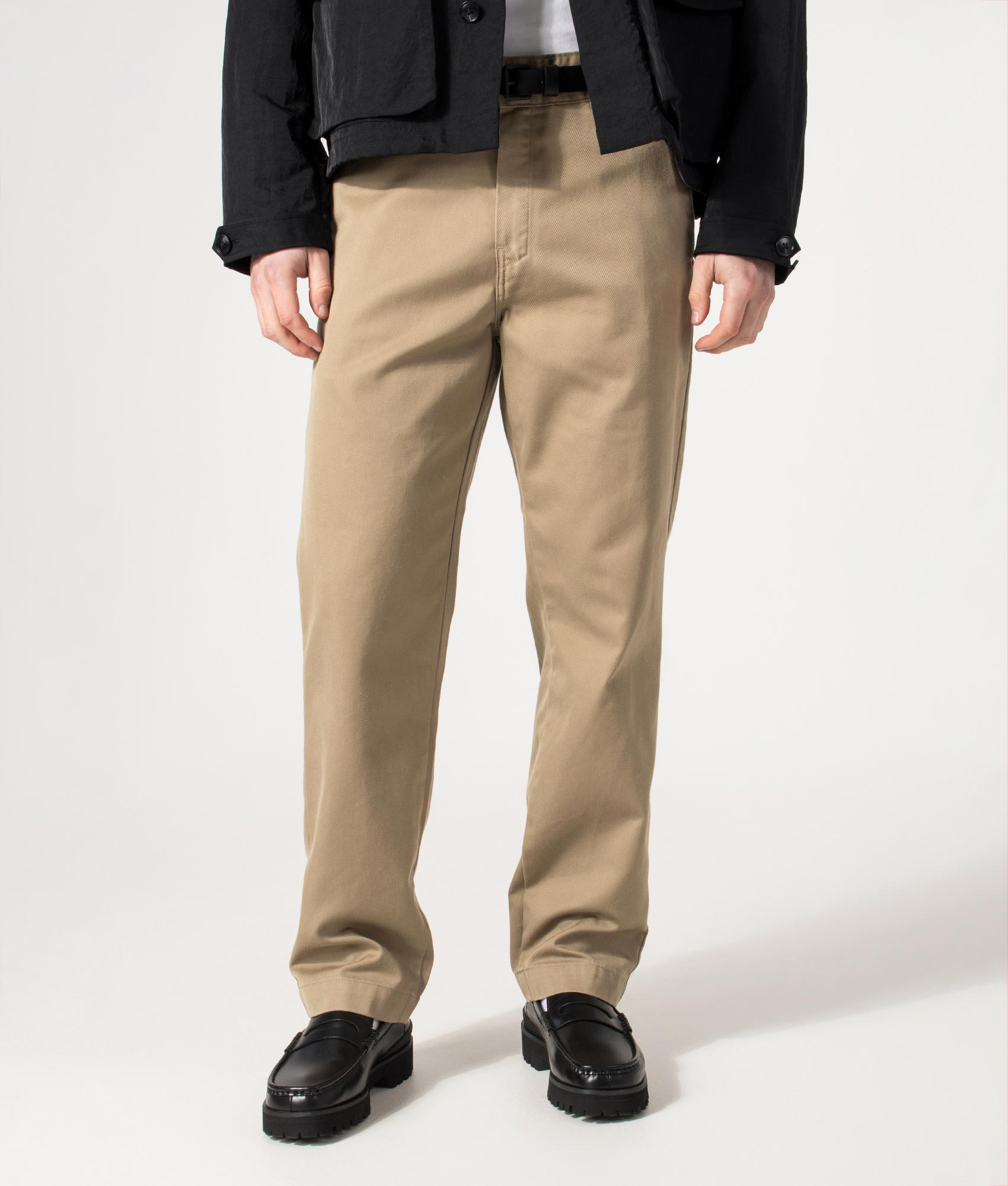 Carhartt WIP Relaxed Fit Tapered Master Pants in Leather Rinsed at EQVVS Menswear. Model front shot.