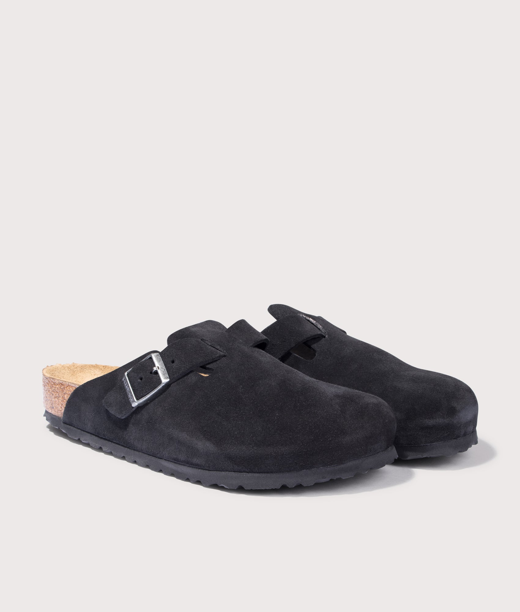 BIRKENSTOCK Boston Suede Leather Clogs in Black. Shot at EQVVS.  Front angle shot 