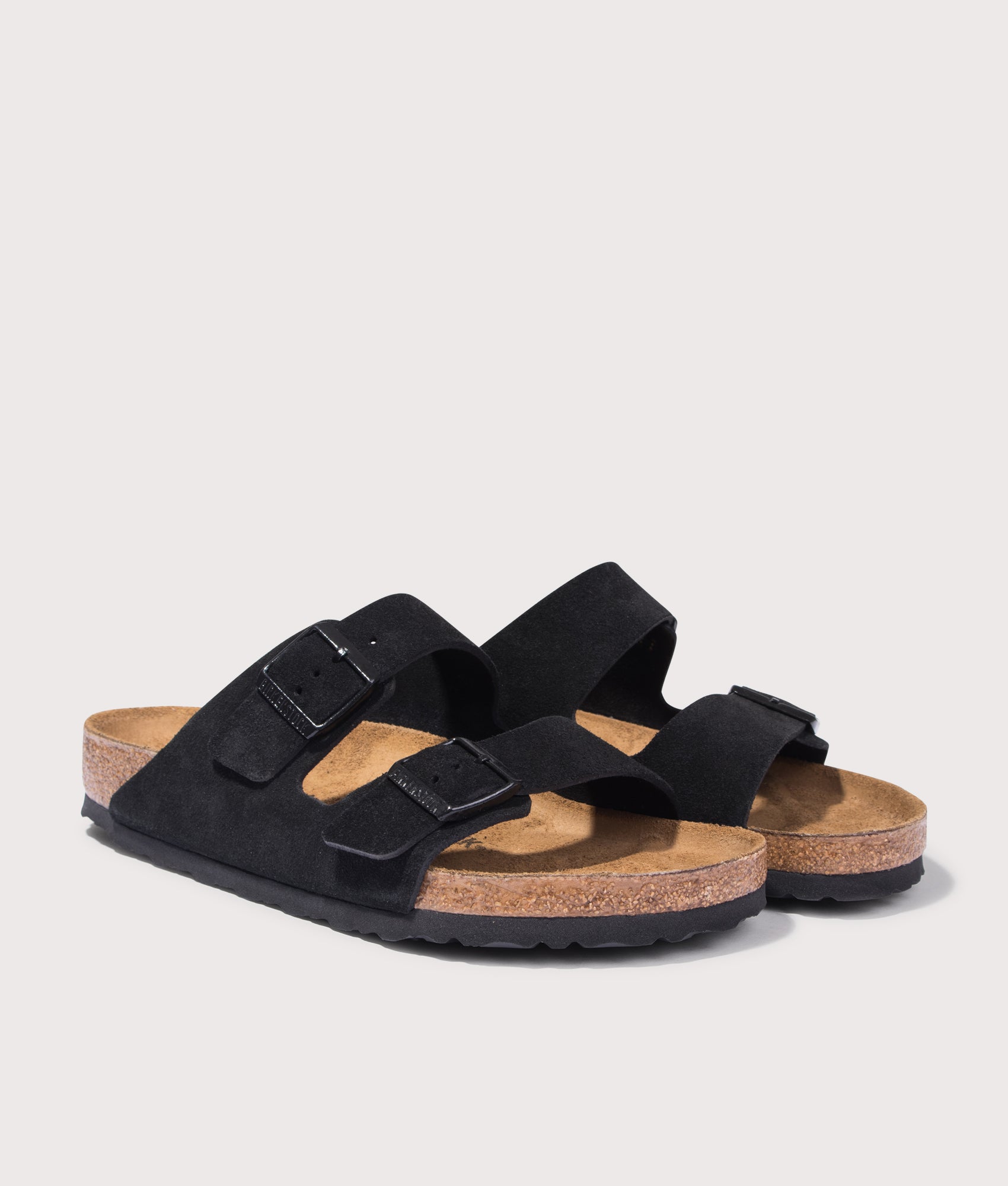 BIRKENSTOCK Arizona Suede Leather Sandals in Black. Shot at EQVVS. Front angle shot 
