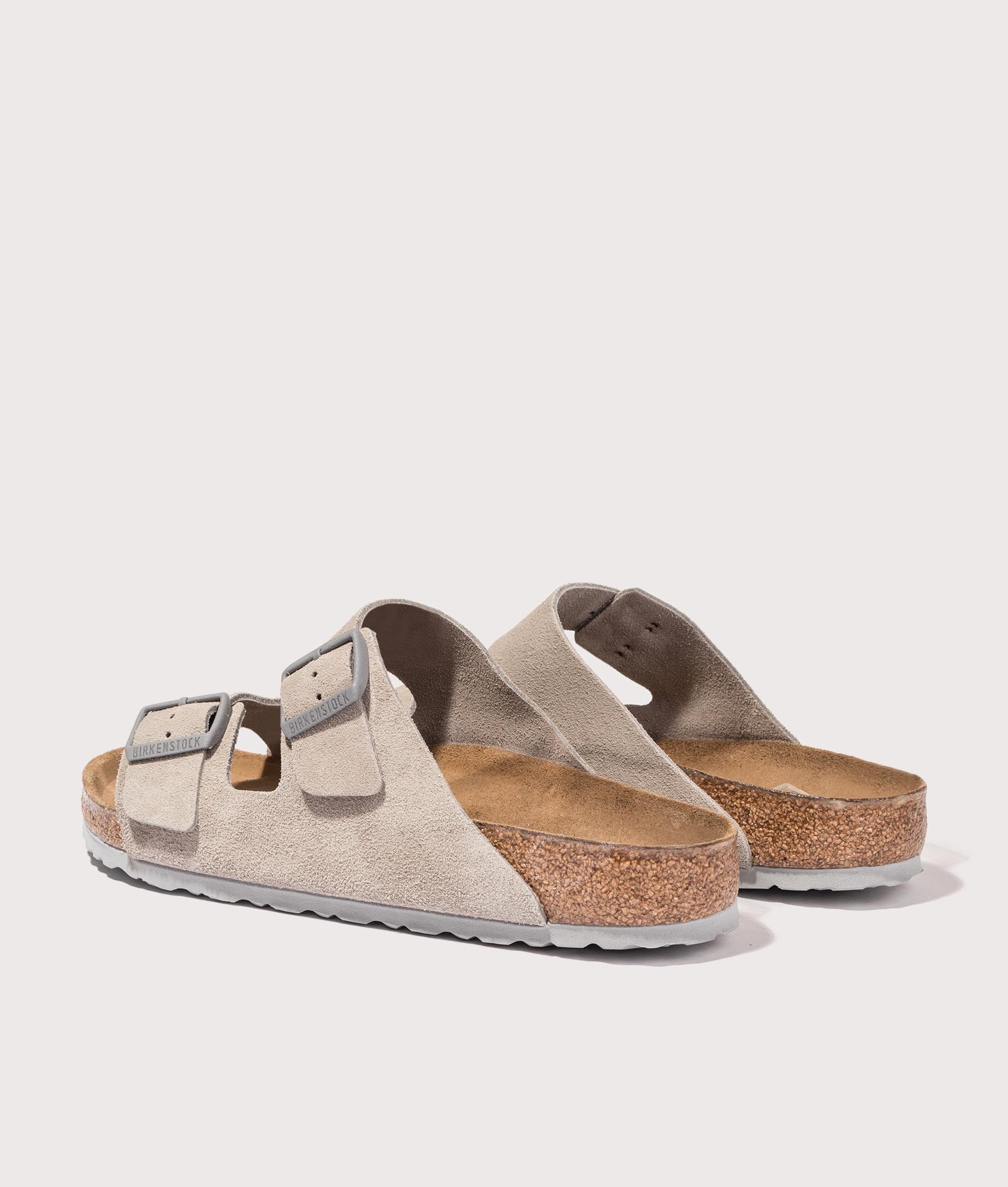BIRKENSTOCK Arizona Suede Leather Sandals in Stone Coin. Shot at EQVVS. Back angle shot 